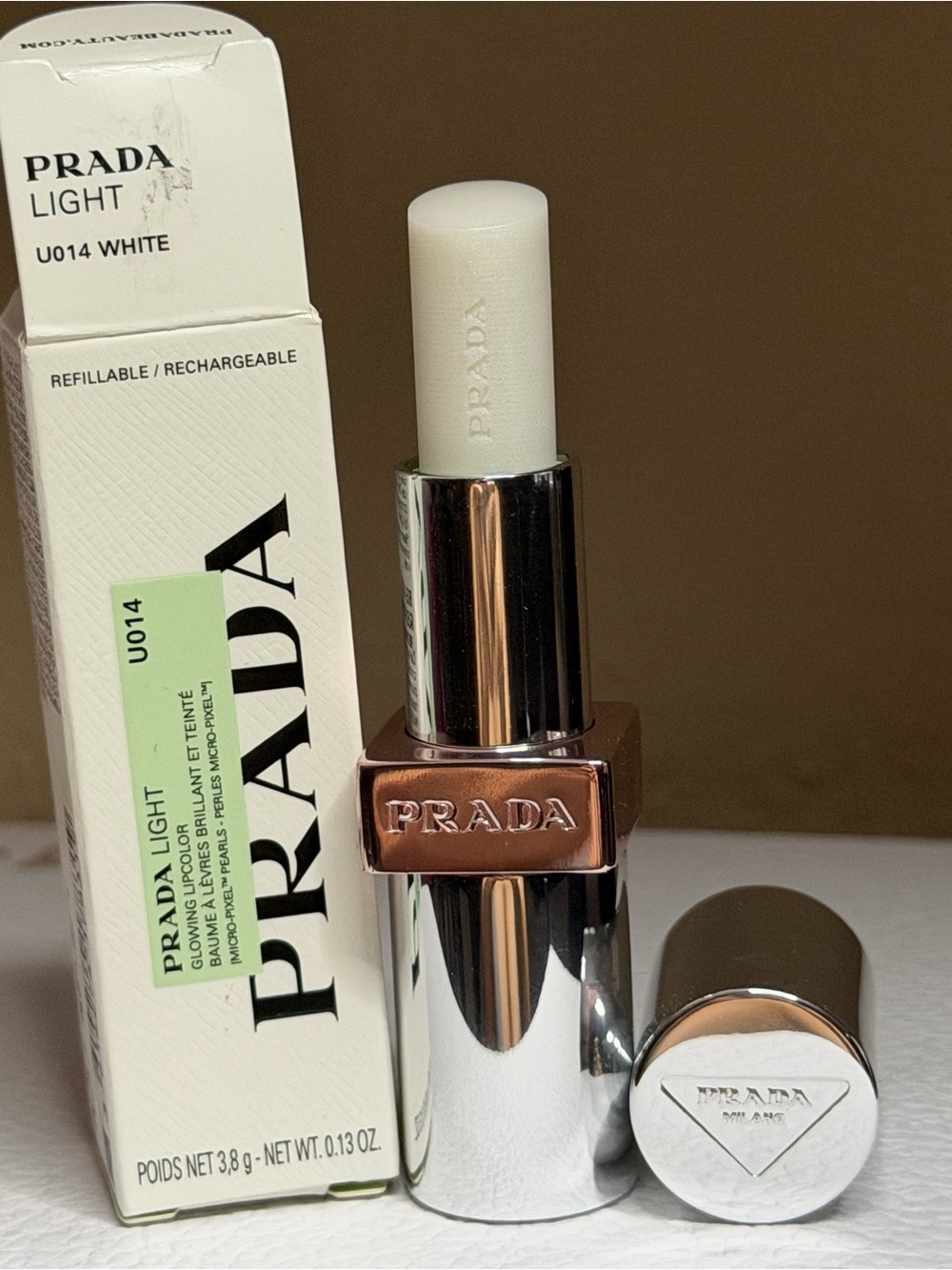 U014 White- Prada Light Glowing Lip Oil Stick